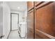 Functional laundry room with washer, dryer, and ample storage space at 1937 Jay St, Lakewood, CO 80214
