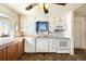 Bright kitchen featuring white cabinetry, neutral countertops, and standard appliances at 315 Depew St, Lakewood, CO 80226