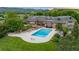 Sprawling property showcasing a large pool, hot tub, manicured lawn, and a luxurious brick home at 8000 N 41St St, Longmont, CO 80503