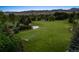 Expansive estate featuring lush green lawn, a serene pond, and a well-maintained putting green for golf enthusiasts at 8000 N 41St St, Longmont, CO 80503