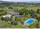 Expansive estate featuring a pool, tennis court, and meticulously landscaped grounds, creating a luxurious outdoor oasis at 8000 N 41St St, Longmont, CO 80503
