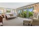 Inviting bedroom with French doors to balcony, plush carpet, and serene views of the surrounding greenery at 8000 N 41St St, Longmont, CO 80503