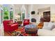 Bright living room with hardwood floors, fireplace, and large windows overlooking the lush greenery at 8000 N 41St St, Longmont, CO 80503