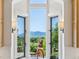Window view features scenic mountain views and natural light, complemented by custom lighting fixtures at 8000 N 41St St, Longmont, CO 80503
