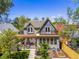 Stunning aerial view of the home featuring backyard oasis, lush greenery, and a pergola at 4348 Umatilla St, Denver, CO 80211