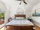 Spacious bedroom with vaulted ceilings and a decorative bed at 4348 Umatilla St, Denver, CO 80211