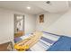 Comfortable bedroom showcases neutral decor, a bed, and leads to other rooms at 4348 Umatilla St, Denver, CO 80211