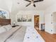 Inviting bedroom boasts a king bed, ensuite bathroom and nature-inspired artwork at 4348 Umatilla St, Denver, CO 80211