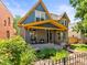 Charming two-story home with a landscaped front yard and inviting front porch at 4348 Umatilla St, Denver, CO 80211