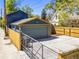 Spacious two-car garage with ample parking, secured by a wooden fence and metal gate at 4348 Umatilla St, Denver, CO 80211