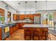 Bright kitchen featuring custom cabinets, modern appliances and a center island at 4348 Umatilla St, Denver, CO 80211