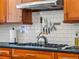 Close up of kitchen with stainless steel appliances and custom cabinetry at 4348 Umatilla St, Denver, CO 80211