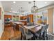 Spacious eat-in kitchen with stainless steel appliances, wood cabinets and a dining area at 4348 Umatilla St, Denver, CO 80211
