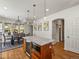Bright eat-in kitchen featuring modern appliances and a center island at 4348 Umatilla St, Denver, CO 80211