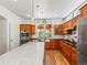 Bright kitchen featuring custom cabinets, modern appliances and a center island at 4348 Umatilla St, Denver, CO 80211