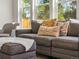 Comfortable living room features a plush sectional and cozy ottoman at 4348 Umatilla St, Denver, CO 80211