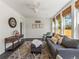 Bright living room with neutral decor, large windows, and stylish accents at 4348 Umatilla St, Denver, CO 80211