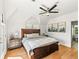 Bright main bedroom featuring hardwood floors, a ceiling fan and ensuite access at 4348 Umatilla St, Denver, CO 80211