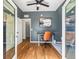 Comfortable office space featuring hardwood floors, a ceiling fan, and natural light at 4348 Umatilla St, Denver, CO 80211