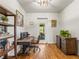Bright office space featuring hardwood floors, custom desk, and shelving at 4348 Umatilla St, Denver, CO 80211