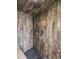 Luxurious shower with wood-look tile and pebble floor at 4348 Umatilla St, Denver, CO 80211