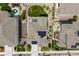 Aerial view of homes with well-maintained lawns, solar panels, backyard patios, and manicured landscaping at 8261 Garden City Ave, Littleton, CO 80125