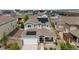 Aerial view of a home showing solar panels, a well-kept lawn, landscaping, and a welcoming front porch at 8261 Garden City Ave, Littleton, CO 80125