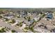Aerial view of a residential neighborhood with homes featuring solar panels and well-maintained landscaping at 8261 Garden City Ave, Littleton, CO 80125