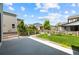 Backyard of a home featuring a well maintained lawn, fenced perimeter, and views of neighboring houses at 8261 Garden City Ave, Littleton, CO 80125