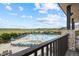 Relaxing community pool with lounge chairs set against a backdrop of serene landscape at 8261 Garden City Ave, Littleton, CO 80125