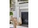 Close-up of the fireplace with elegant tile work and built-in shelving at 8261 Garden City Ave, Littleton, CO 80125