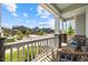 Inviting front porch with seating and a view of the neighborhood street at 8261 Garden City Ave, Littleton, CO 80125