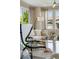 Cozy living room with large windows, neutral colors, and modern furnishings at 8261 Garden City Ave, Littleton, CO 80125