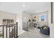 Open loft area features a workspace, window, and comfortable seating at 8261 Garden City Ave, Littleton, CO 80125