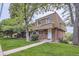 Charming brick townhome featuring a well-manicured lawn and inviting front entrance at 5712 S Lowell Blvd, Littleton, CO 80123