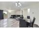 Inviting living room area with modern lighting, stylish furnishings, and dining table at 5712 S Lowell Blvd, Littleton, CO 80123