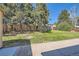 Spacious backyard area featuring green grass and trees, perfect for outdoor activities at 13483 Achilles Dr, Lone Tree, CO 80124