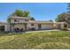 An open backyard featuring a covered patio with outdoor seating and a shed in the corner at 13483 Achilles Dr, Lone Tree, CO 80124