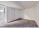 View of the carpeted basement with white walls and trim, and access to another room at 13483 Achilles Dr, Lone Tree, CO 80124