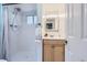 Bathroom featuring a walk-in shower, a single sink vanity, and a towel rack at 13483 Achilles Dr, Lone Tree, CO 80124