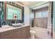 Contemporary bathroom featuring a vessel sink, stylish backsplash, modern fixtures, and tub shower combo at 13483 Achilles Dr, Lone Tree, CO 80124