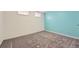 Bedroom with soft gray carpet and bright colored accent wall at 13483 Achilles Dr, Lone Tree, CO 80124