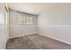 Bedroom featuring gray walls and carpet, and a window letting in natural light at 13483 Achilles Dr, Lone Tree, CO 80124