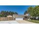 Charming home with an attached garage, well-maintained lawn, and a welcoming front entrance at 13483 Achilles Dr, Lone Tree, CO 80124