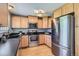 Updated kitchen featuring stainless steel appliances, light wood cabinets, and modern finishes at 13483 Achilles Dr, Lone Tree, CO 80124
