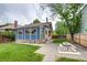 Spacious backyard with a brick patio, grassy area, and stylish exterior details, ideal for outdoor entertaining at 3525 N Alcott St, Denver, CO 80211