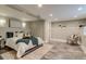 Modern bedroom featuring a queen bed and decorative chair, with neutral walls and recessed lighting at 3525 N Alcott St, Denver, CO 80211