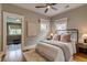 Bedroom with natural light, ceiling fan, ensuite bathroom and neutral color scheme at 3525 N Alcott St, Denver, CO 80211