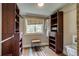 Walk-in closet with wooden shelving and ample storage space at 3525 N Alcott St, Denver, CO 80211