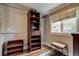 Walk-in closet with a built in storage system and hardwood flooring at 3525 N Alcott St, Denver, CO 80211